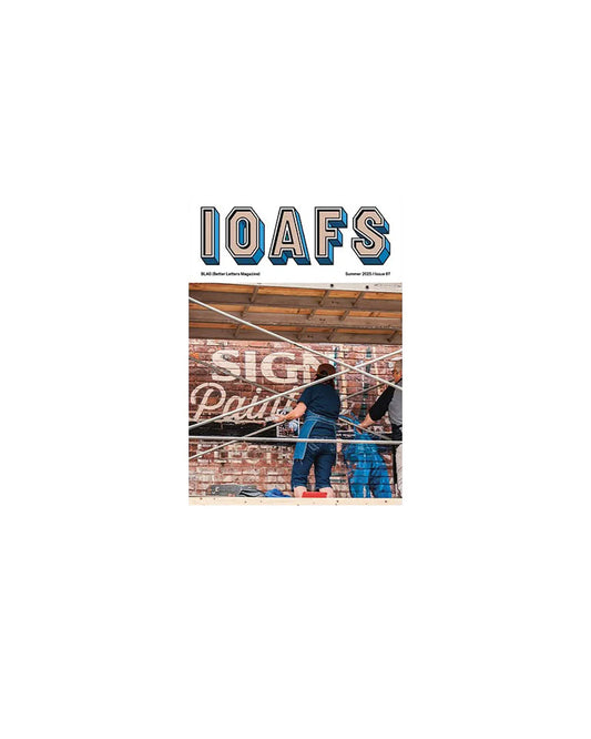 Cover of a magazine with 'IOAFS' branding and a photo of two people working on a sign.