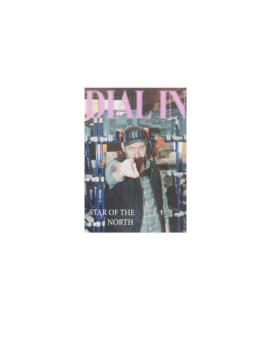 Magazine cover with a person wearing a hat and plaid jacket, featuring text 'Dial In' and 'Star of the North'.