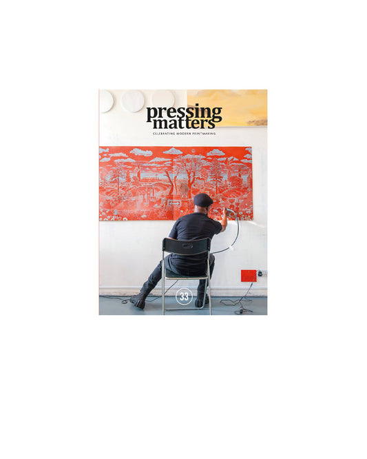 Magazine cover titled 'Pressing Matters' with a person sitting in front of a large artwork.